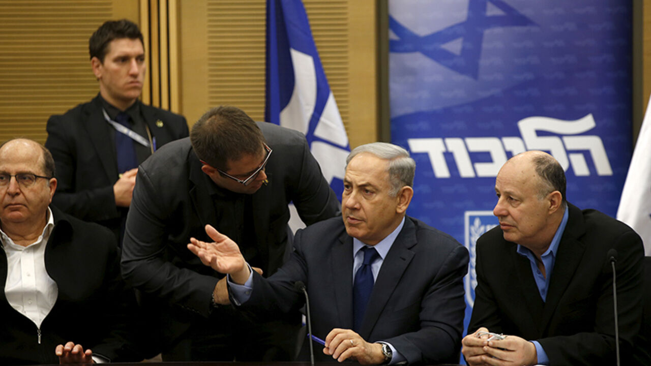 ISRAEL-LAW/NGO Israel's Prime Minister Benjamin Netanyahu (C) chats with members of his party during a meeting of his Likud party meeting in the Israeli parliament in Jerusalem February 8, 2016. A bill that opponents say targets Israeli human rights groups critical of Israel's policies towards the Palestinians was set to win initial approval in parliament on Monday with the support of the country's right-wing. It is widely expected to receive preliminary approval in the Knesset late on Monday. REUTERS/Ronen Zvulun - RTX