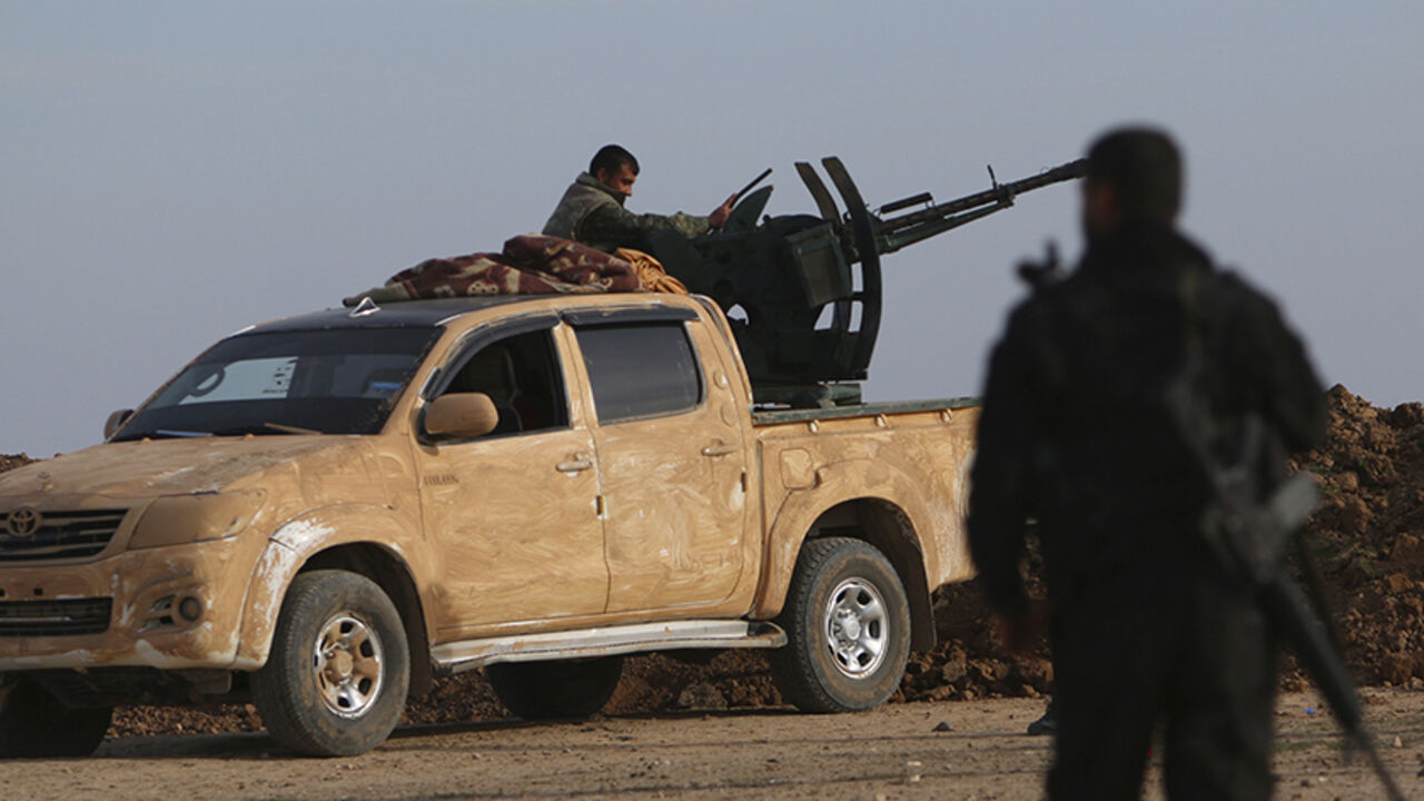 MIDEAST-CRISIS/SYRIA Fighters from the Democratic Forces of Syria position themselves in Ghazila village after taking control of the town from Islamic State forces in the southern countryside of Hasaka, Syria February 17, 2016. Picture taken February 17, 2016. REUTERS/Rodi Said - RTX27JLM