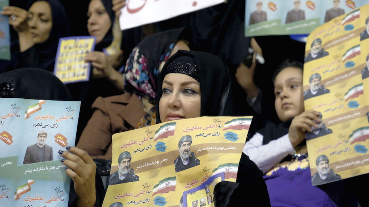 IRAN-ELECTION/ Supporters of Ali Motahari, a candidate for the upcoming parliamentary elections, hold his electoral posters during a campaign gathering of candidates mainly close to the reformist camp, in Tehran February 23, 2016. REUTERS/Raheb Homavandi/TIMAATTENTION EDITORS - THIS IMAGE WAS PROVIDED BY A THIRD PARTY. FOR EDITORIAL USE ONLY. - RTX287FM