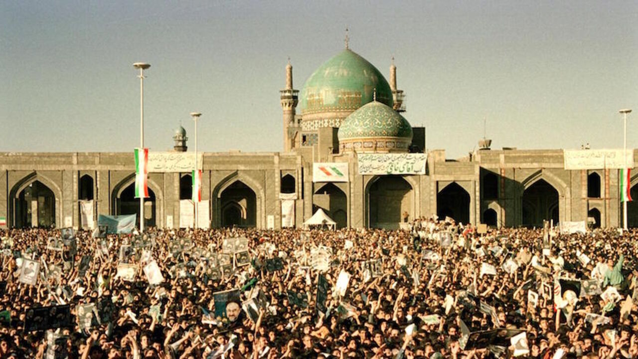 APP2000060619387 Thousands of Iranians from Mashhad welcome President Mohammad Khatami outside the Shiite Muslim shrine of Imam Reza in the northeastern holy city 05 June 2000. During the February parliamentary elections in Iran, an ultra-conservative cleric was turned out of office and pro-Khatami reformers won all five seats in Mashhad, Iran's second largest city which is usually a right-wing stronghold. This is Khatami's first trip to the region since he came to power in 1997. (Photo credit should read ATTA KENARE/AFP/G