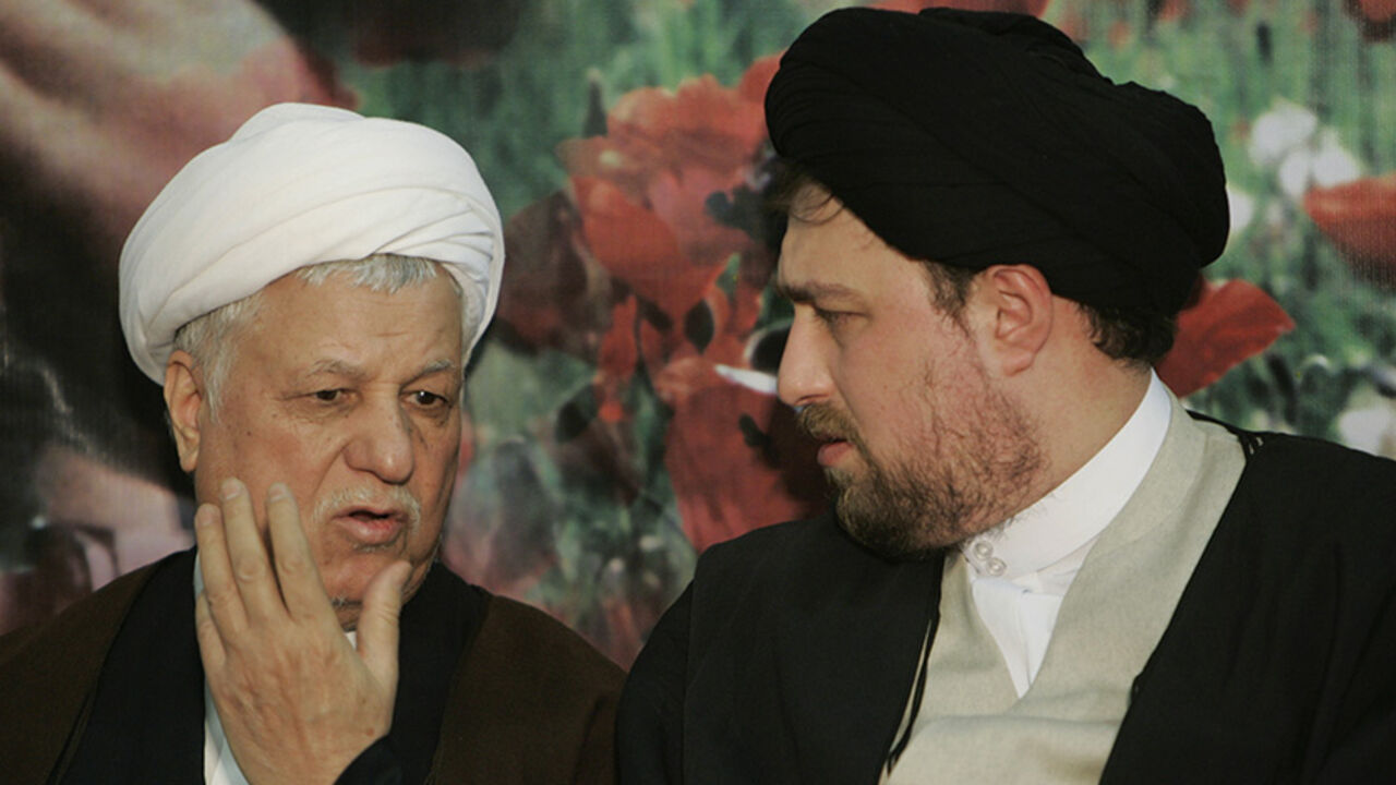 IRAN Former Iranian President Akbar Hashemi Rafsanjani (L) speaks with the late Ayatollah Ruhollah Khomeini's grandson, Hassan Khomeini, during the anniversary ceremony of Iran's Islamic revolution at the Khomeini shrine in the Behesht Zahra cemetery, south of Tehran, February 1, 2007. REUTERS/Raheb Homavandi (IRAN) - RTR1LV47