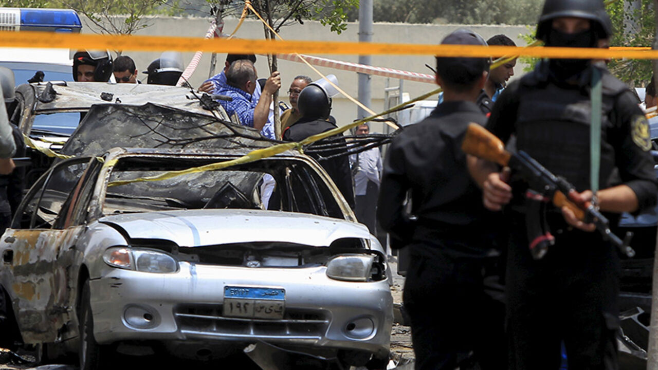 EGYPT-VIOLENCE Policemen secure the site of a car bomb attack on the convoy of Egyptian public prosecutor Hisham Barakat near his house at Heliopolis district in Cairo, Egypt, June 29, 2015. Barakat died from wounds sustained in a bomb attack on Monday that had targeted his convoy in Cairo, state news agency MENA said. REUTERS/Mohamed Abd El Ghany - RTX1I9OL