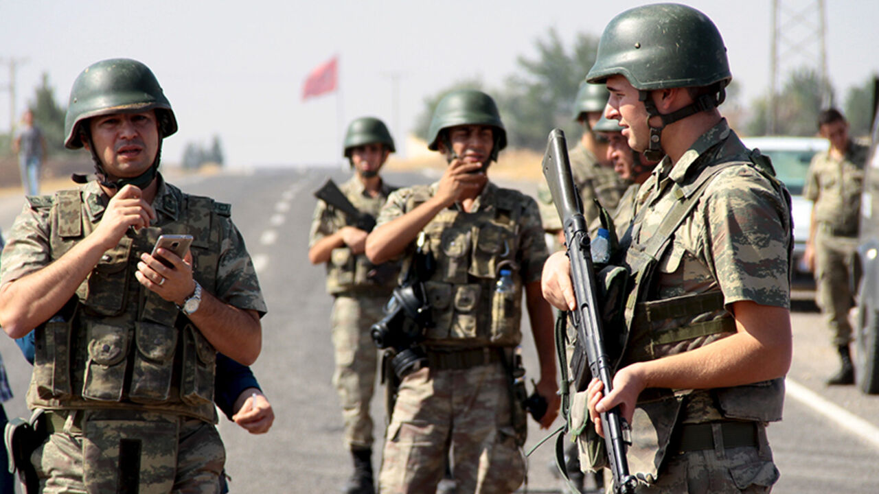 EUROPE-MIGRANTS/FUNERAL Turkish soldiers stand guard as a funeral convoy, carrying coffins of drowned Syrian migrants including the three-year old boy Aylan Kurdi, drives to the Turkish-Syrian border in Suruc, bordering with the northern Syrian town of Kobani, Turkey, September 4, 2015. Two Syrian toddlers who drowned with their mother as they were trying to reach Greece were laid to rest in the Syrian town of Kobani on Friday, a Reuters witness said. A photograph of the body of one of the toddlers, 3-year-old Aylan Kurdi, washed