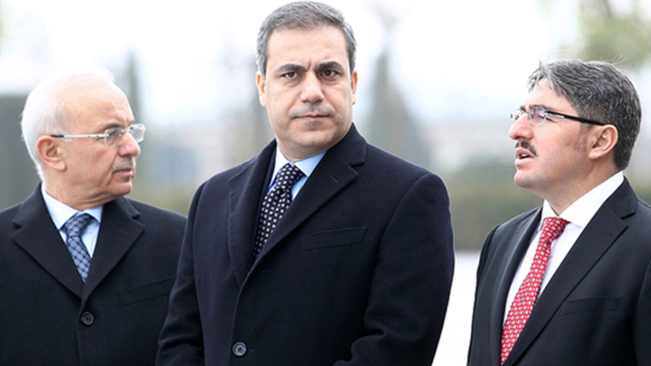 Par8093162 This file picture taken on December 19, 2014 shows the head of Turkey's intelligence agency Hakan Fidan (C) standing in Ankara. The powerful head of Turkey's intelligence agency, one of the most loyal allies of President Recep Tayyip Erdogan, has resigned to stand for election as a lawmaker, the official Anatolia news agency said on February 7, 2015. The resignation of Hakan Fidan, who has headed the National Intelligence Agency (MIT) since 2010, has been accepted by Prime Minister Ahmet Davutoglu and will