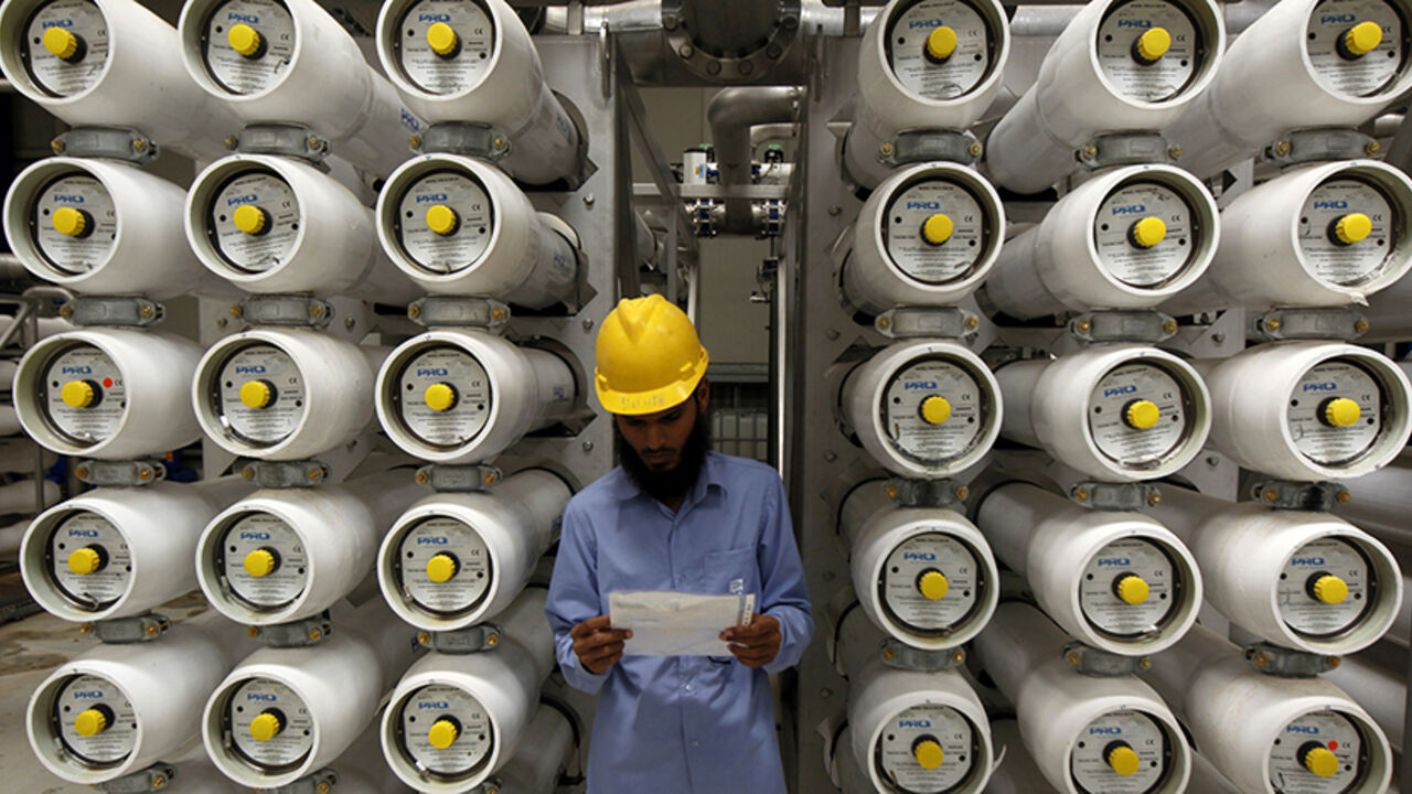SAUDI-WATER/ A worker stands at a desalination plant, 35 lm south of Riyadh, May 4, 2011. Long before it understood the value of oil, the desert kingdom of Saudi Arabia knew the worth of water. But the leading oil exporter's water challenges are growing as energy-intensive desalination erodes oil revenues while peak water looms more ominously than peak oil -- the theory that supplies are at or near their limit, with nowhere to go but down. Picture taken May 4, 2011. To match Feature SAUDI-WATER/ REUTERS/Fahad Shadeed