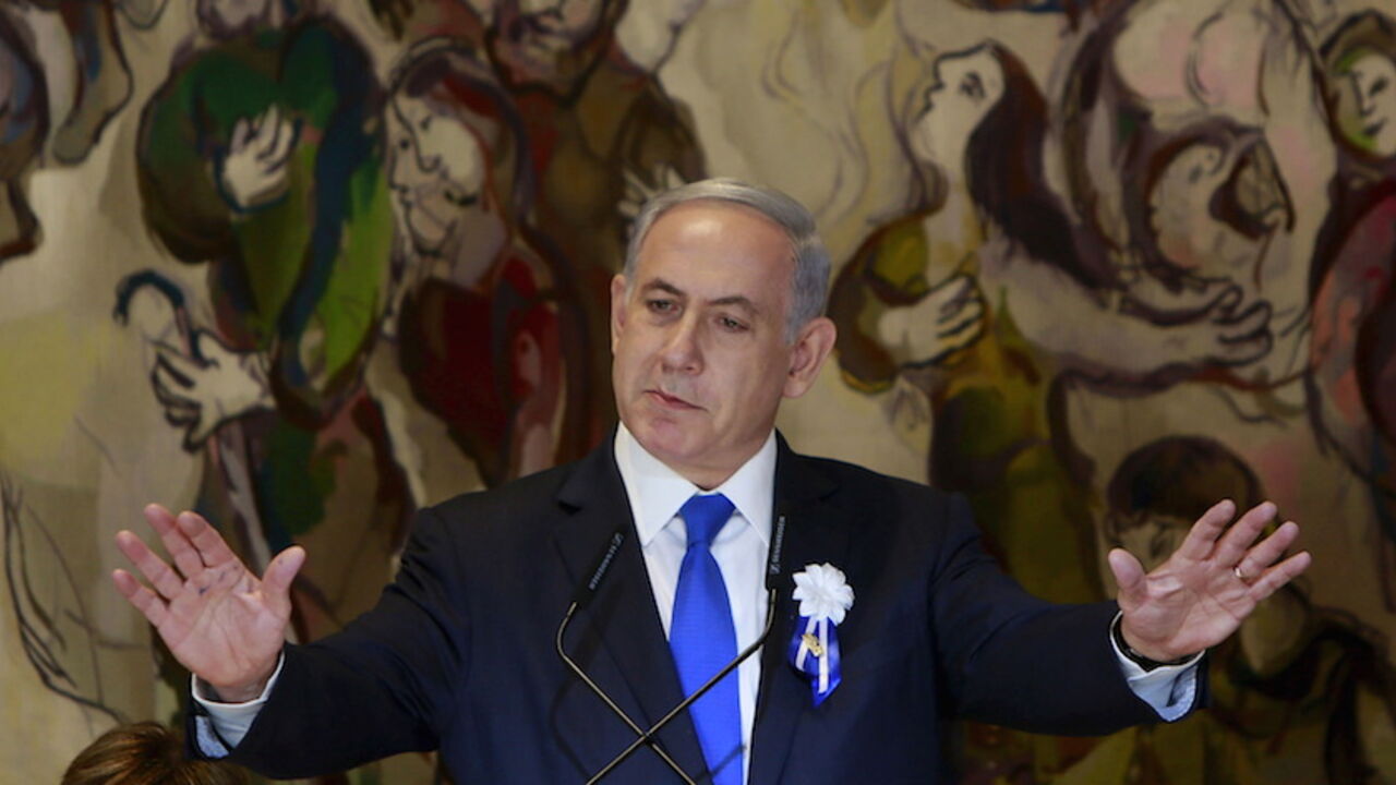 IRAN-NUCLEAR/ISRAEL Israel's Prime Minister Benjamin Netanyahu gestures as he speaks at an event following the swearing-in ceremony of the 20th Knesset, the new Israeli parliament, in Jerusalem March 31, 2015. Netanyahu said on Tuesday the framework Iranian nuclear agreement being sought by international negotiators will leave Iran with the capability to develop a nuclear weapon in under a year. REUTERS/Gali Tibbon/Pool - RTR4VMVY
