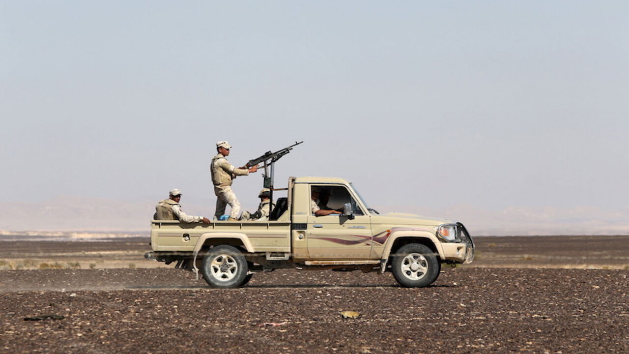 An Egyptian army vehicle guard the site where a Russian airliner crashed in the al-Hasanah area  in El Arish city, north Egypt, November 1, 2015. Russia has grounded Airbus A321 jets flown by the Kogalymavia airline, Interfax news agency reported on Sunday, after one of its fleet crashed in Egypt's Sinai Peninsula, killing all 224 people on board. REUTERS/Mohamed Abd El Ghany - RTX1U8ZS