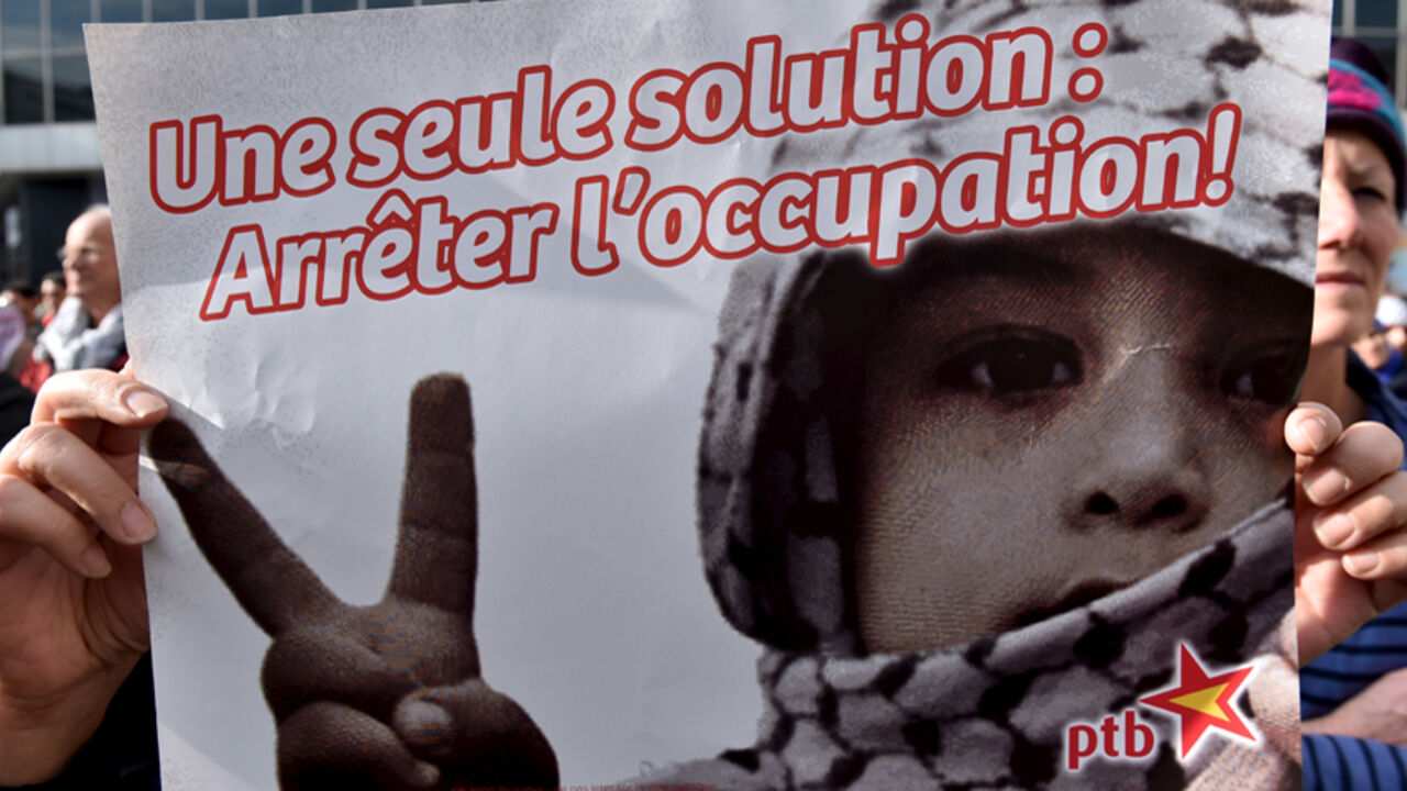 ISRAEL-PALESTINIANS/BELGIUM A protester holds a sign, which reads: "Only one solution: stop occupation", during a demonstration in solidarity with Palestinians, in Brussels, Belgium, October 18, 2015. REUTERS/Eric Vidal - RTS4Z1P