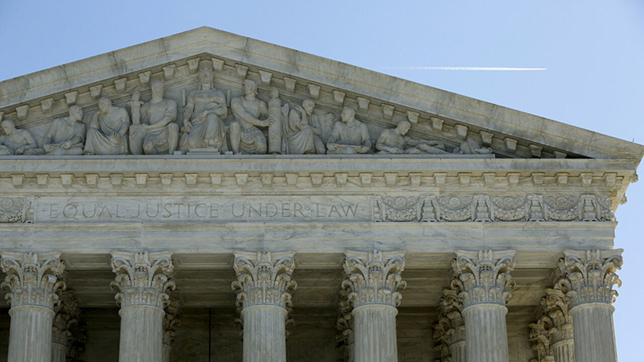 USA-COURT/UNIONS The U.S. Supreme Court is seen in Washington March 29, 2016. The U.S. Supreme Court on Tuesday split 4-4 for the first time in a major case since the death of Justice Antonin Scalia on a conservative legal challenge to a vital source of funds for organized labor, affirming a lower-court ruling that allowed California to force non-union workers to pay fees to public-employee unions. REUTERS/Gary Cameron - RTSCOU4