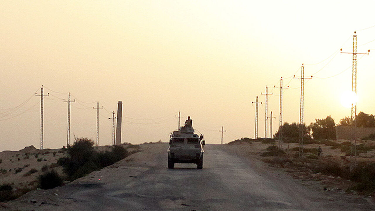SINAI-SECURITY/EGYPT An Egyptian military vehicle is seen on the highway northern Sinai, May 25, 2015. Authorities in the Sinai Peninsula are battling insurgents who support Islamic State, the militant group that has seized parts of Iraq, Syria and Libya. The Sinai conflict, which has has displaced hundreds of Egyptians, is the biggest security challenge for President Abdel Fattah al-Sisi, who has promised to deliver stability after four years of turmoil triggered by the 2011 uprising. Picture taken May 25, 2015. REUTERS/Asmaa