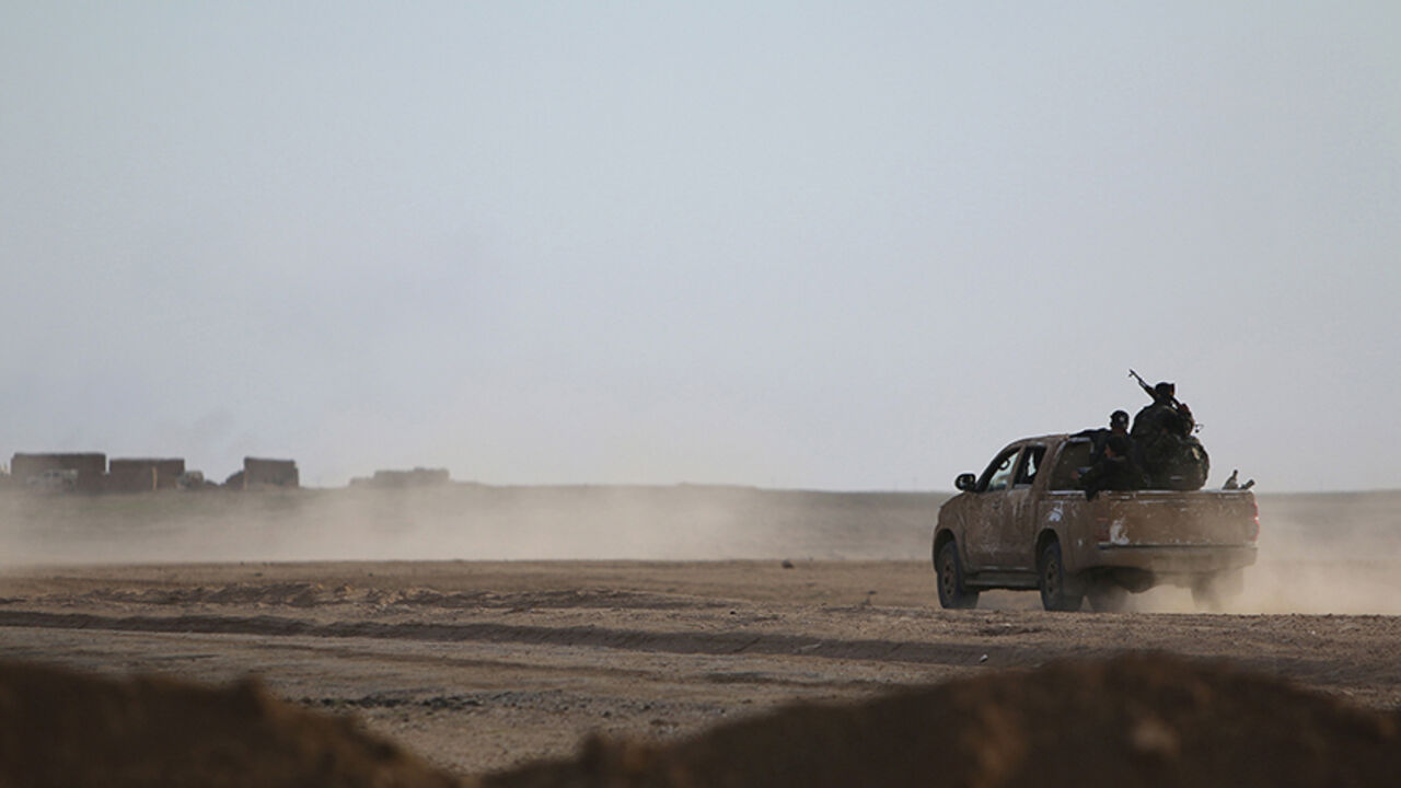 MIDEAST-CRISIS/SYRIA Fighters from the Democratic Forces of Syria drive to position themselves in Ghazila village after taking control of the town from Islamic State forces in the southern countryside of Hasaka, Syria February 17, 2016. Picture taken February 17, 2016. REUTERS/Rodi Said - RTX27JLU