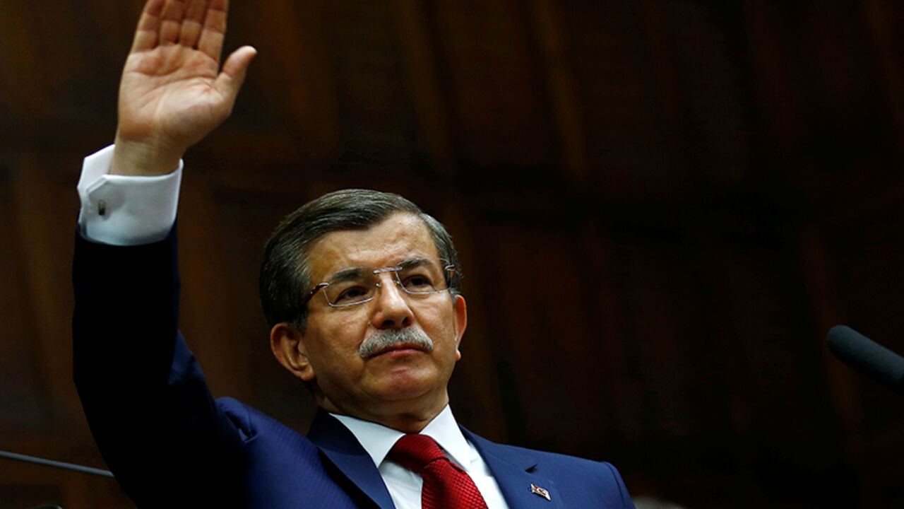 TURKEY-POLITICS/ Turkey's Prime Minister Ahmet Davutoglu greets members of parliament from his ruling AK Party (AKP) as he arrives a meeting at the Turkish parliament in Ankara, Turkey, May 3, 2016. REUTERS/Umit Bektas - RTX2CLC7