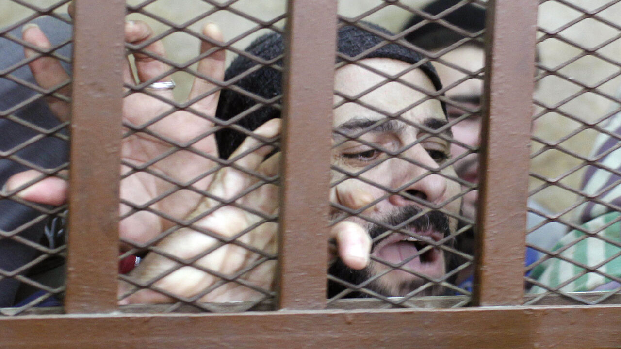 EGYPT-GAYS/COURT Defendants react after hearing the verdict at a court in Cairo January 12, 2015. An Egyptian court on Monday ordered the release of 26 men who were detained last month in a raid on a Cairo bath house after police received a tip that they were holding gay orgies."The court has ruled that all the accused are innocent," the judge said. REUTERS/Asmaa Waguih (EGYPT - Tags: POLITICS CRIME LAW CIVIL UNREST) - RTR4L2M4