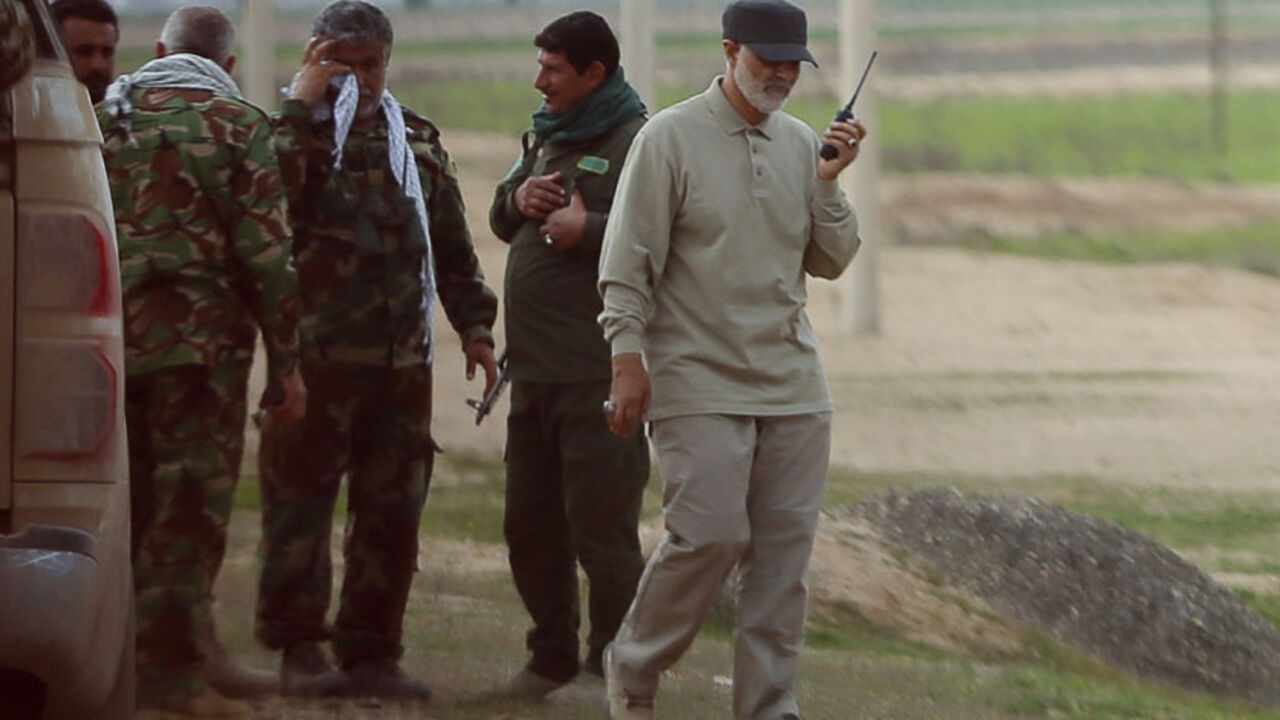 MIDEAST-CRISIS/IRAQ Iranian Revolutionary Guard Commander Qassem Soleimani uses a walkie-talkie at the frontline during offensive operations against Islamic State militants in the town of Tal Ksaiba in Salahuddin province March 8, 2015. Picture taken March 8, 2015. REUTERS/Stringer (IRAQ - Tags: CIVIL UNREST CONFLICT POLITICS) - RTR4TU0N