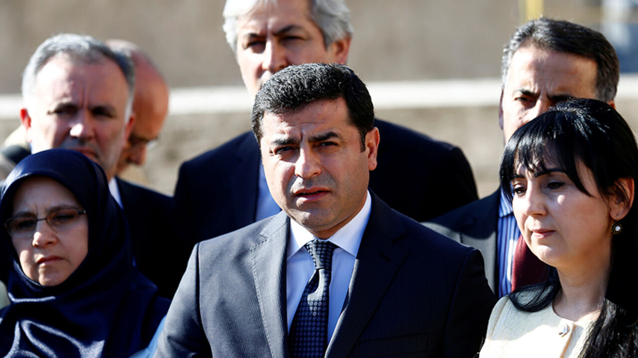 TURKEY-POLITICS/IMMUNITY Co-chairs of the pro-Kurdish Peoples' Democratic Party (HDP), Selahattin Demirtas and Figen Yuksekdag (R), are flanked by fellow lawmakers as they attend a news conference at the entrance of the Turkish parliament in Ankara, Turkey, May 20, 2016. REUTERS/Umit Bektas TPX IMAGES OF THE DAY - RTSF6OZ
