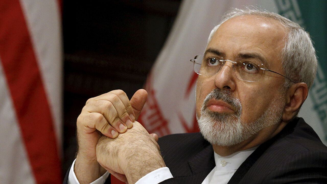 IRAN-NUCLEAR/KERRY Iran's Foreign Minister Mohammad Javad Zarif listens as U.S. Secretary of State John Kerry (unseen) speaks to the media during a meeting in Manhattan, New York City, U.S., April 22, 2016. REUTERS/Brendan McDermid - RTX2B9VT