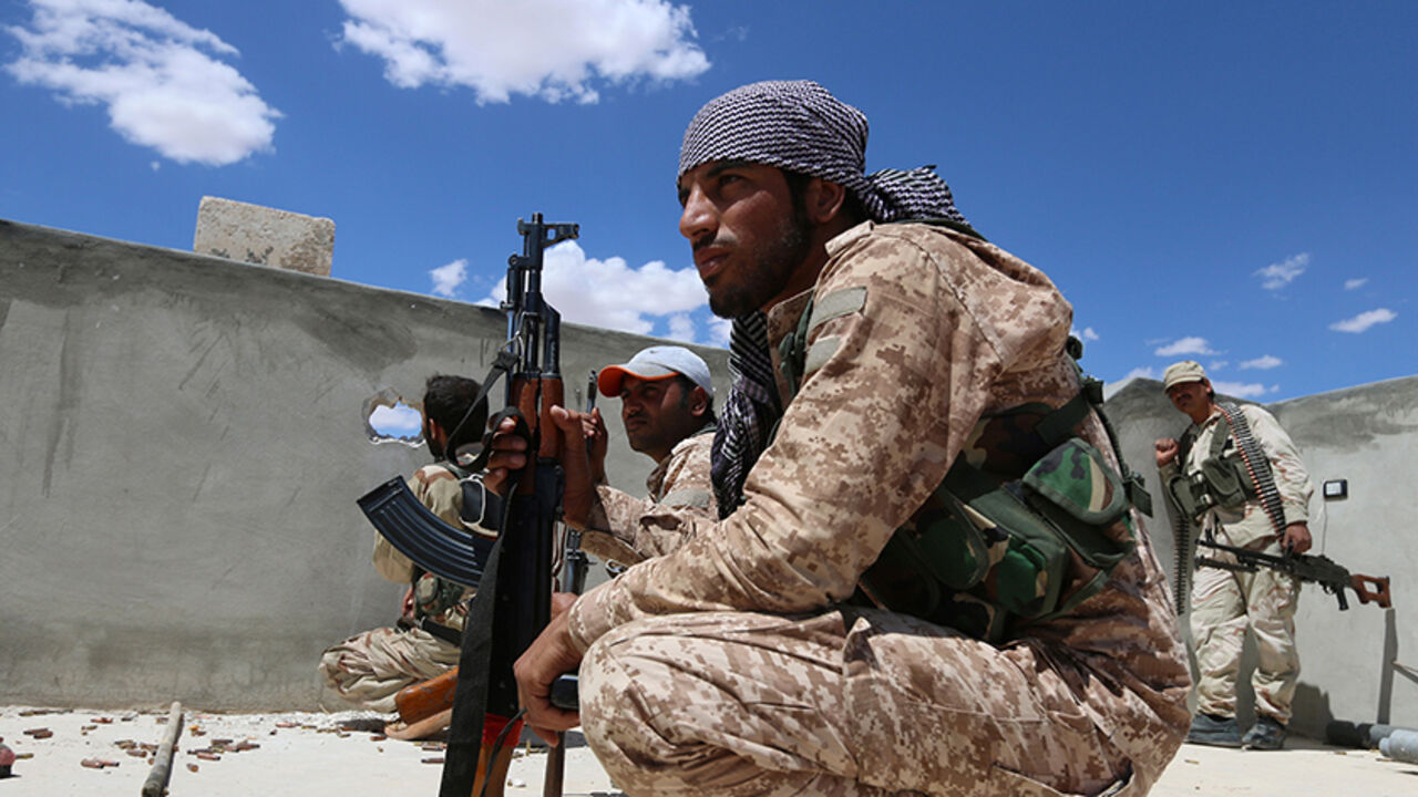 Syria Democratic Forces fighters take positions as they await U.S.-led air strikes on Manbij's mills where Islamic State militants are positioned, in Aleppo Governorate, Syria June 16, 2016. REUTERS/Rodi Said - RTX2GMD1