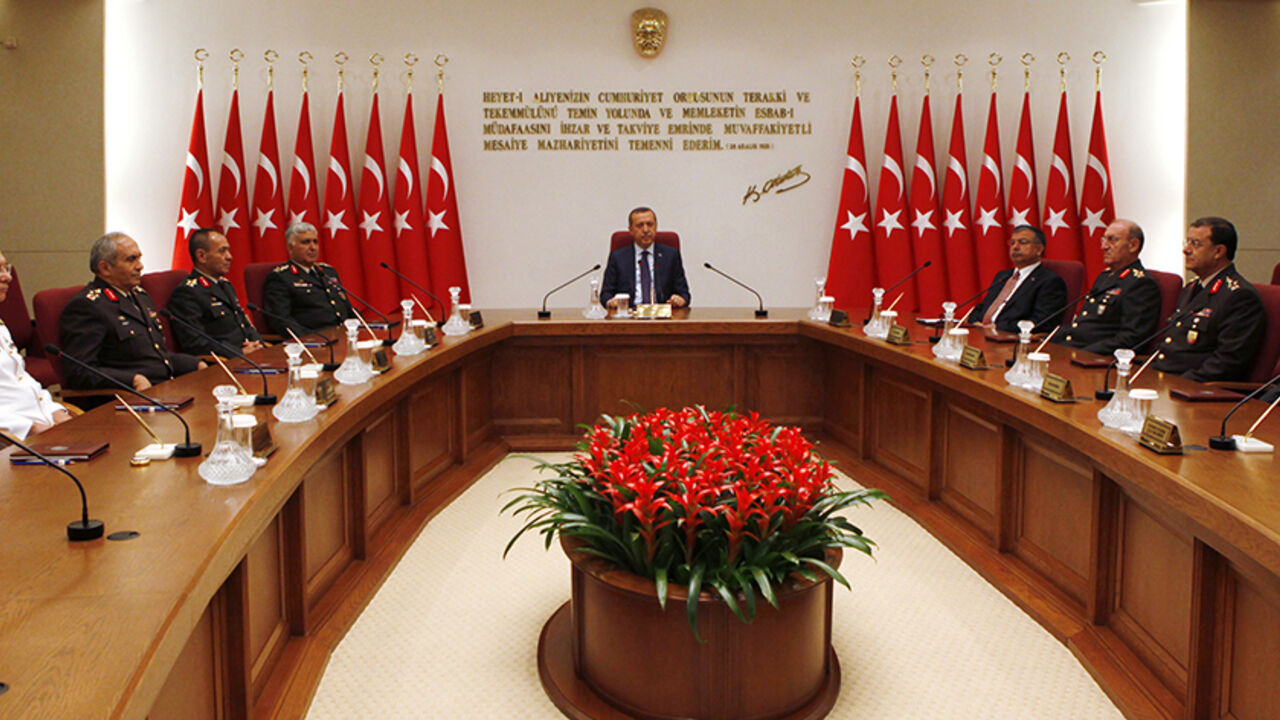 TURKEY-MILITARY/ Turkey's Prime Minister Tayyip Erdogan (C) chairs the annual meeting of the Supreme Military Council (YAS) as he is flanked by Ground Forces Commander and acting Chief of Staff General Necdet Ozel (5th L), Defense Minister Ismet Yilmaz (4th R) and the other top army officers in Ankara August 1, 2011. Erdogan chaired a meeting of the military top brass on Monday, looking to restore order in NATO's second-biggest army after its top four generals quit in protest at the jailing of hundreds of officers. The long
