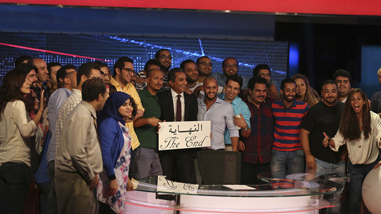 EGYPT-YOUSSEF Egyptian satirist Bassem Youssef (C) poses for a photo with the crew of his show 'al-Bernameg' after announcing its cancellation in Cairo June 2, 2014. Egypt's top TV satirist said on Monday his show had been canceled, amid speculation it was because his latest script poked fun at a presidential election won by the former army chief.Bassem Youssef, known as the "Egyptian Jon Stewart", told a news conference the Saudi-owned MBC Masr TV station had been put under more pressure "than it could handle".REUTERS/M