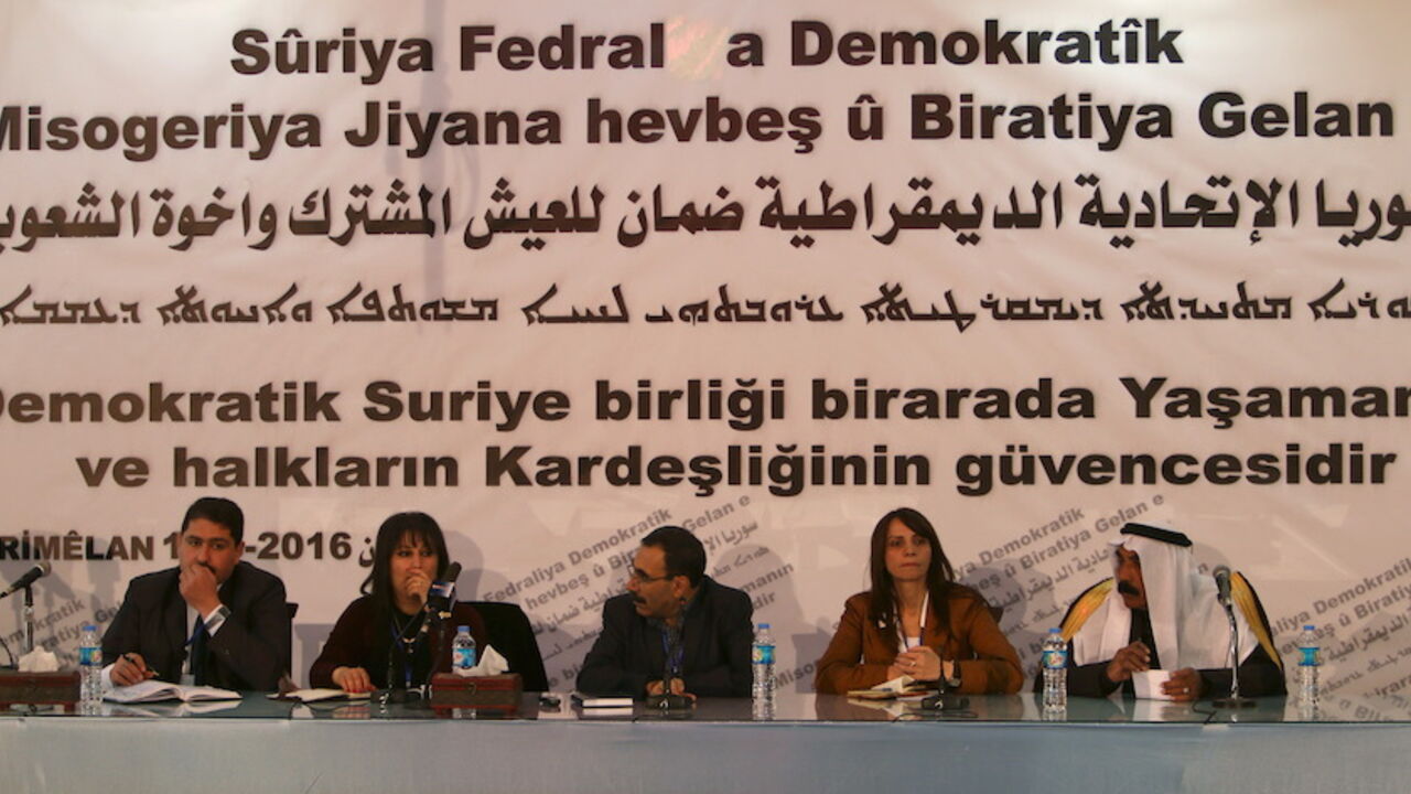 Bureau members of a preparatory conference to announce a federal system discuss a "Democratic Federal System for Rojava - Northern Syria" in the Kurdish-controlled town of Rmeilan, Hasaka province Bureau members of a preparatory conference to announce a federal system discuss a "Democratic Federal System for Rojava - Northern Syria" in the Kurdish-controlled town of Rmeilan, Hasaka province, Syria March 16, 2016. REUTERS/Rodi Said - RTSARA8