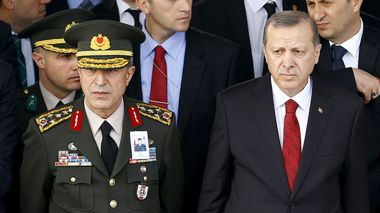 TURKEY-SECURITY/MILITARY-CHIEF-AKAR Turkish President Tayyip Erdogan (R) and Chief of Staff General Hulusi Akar attend a funeral ceremony for Army officer Seckin Cil in Ankara, Turkey, February 18, 2016. REUTERS/Umit Bektas/File Photo - RTSI8ML