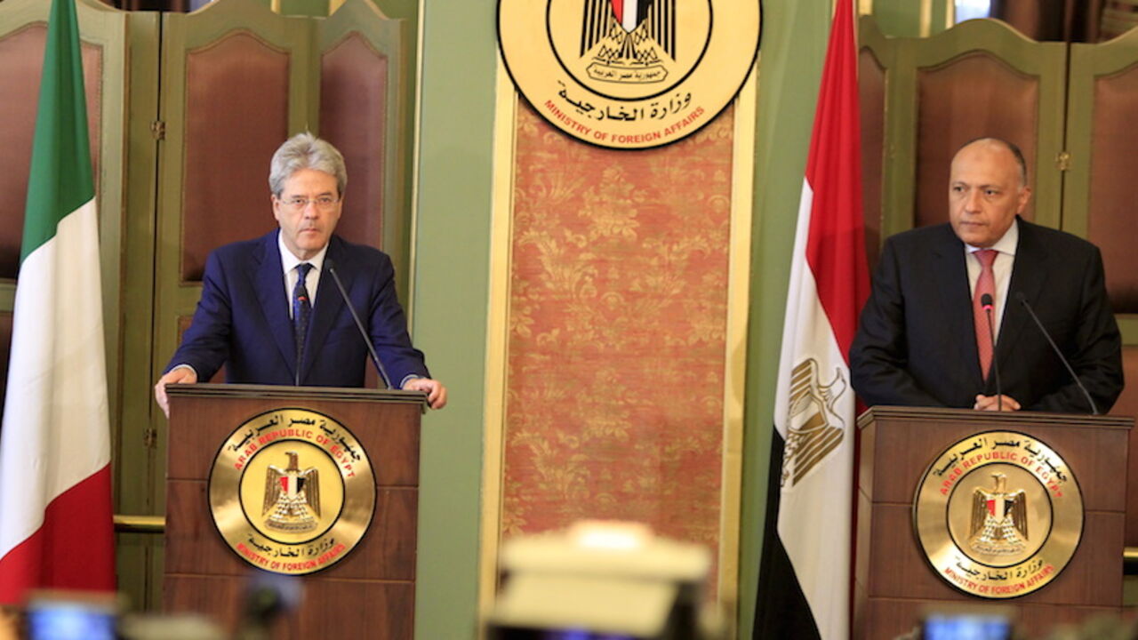 Italian Foreign Minister Paolo Gentiloni listens during a news conference with his Egyptian counterpart Sameh Shoukry at the foreign ministry in Cairo Italian Foreign Minister Paolo Gentiloni (L) listens during a news conference with his Egyptian counterpart Sameh Shoukry at the foreign ministry in Cairo, Egypt, July 13, 2015. The visit comes two days after Islamic State claimed responsibility for a car bomb attack at the Italian consulate in central Cairo on Saturday, in an escalation of violence that suggests militants are opening a new front against foreigners in Egypt. REUTERS/Mohamed Abd El Ghany - RTX1K80W