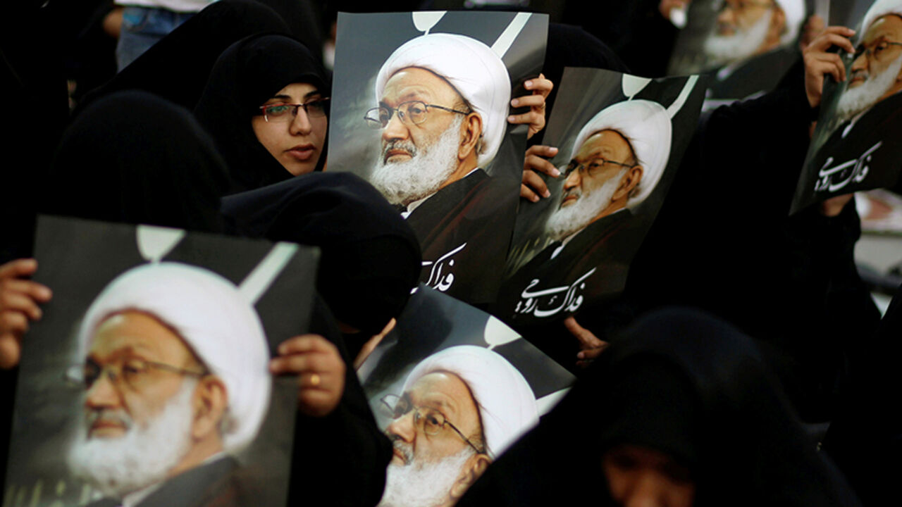 BAHRAIN-POLITICS/CLERIC Supporters hold posters of Bahrain's leading Shi'ite cleric Isa Qassim during a sit-in outside his home in the village of Diraz west of Manama, Bahrain June 21, 2016. REUTERS/Hamad I Mohammed TPX IMAGES OF THE DAY - RTX2HIPR