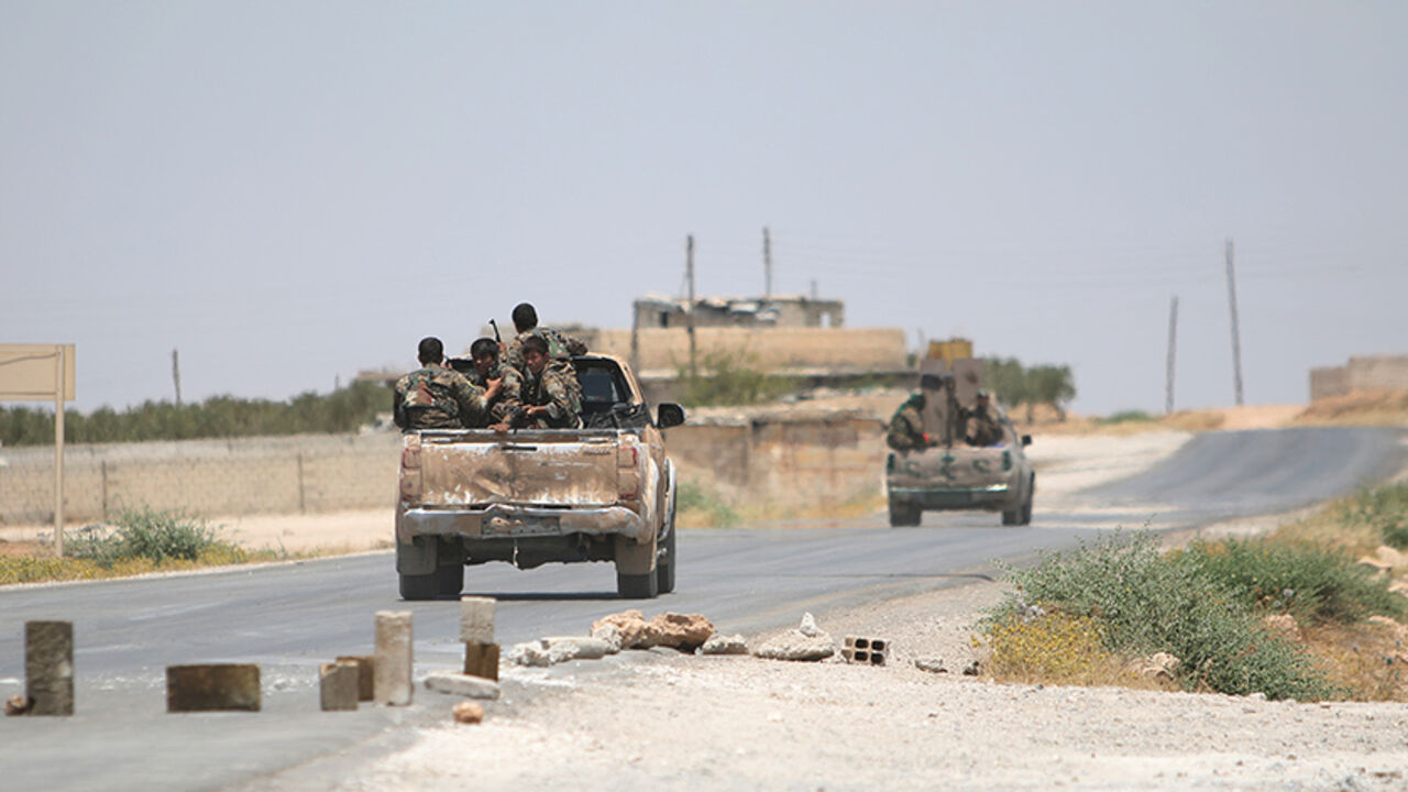 MIDEAST-CRISIS-SYRIA-ISLAMIC-STATE Syria Democratic Forces (SDF) ride vehicles along a road near Manbij, in Aleppo Governorate, Syria, June 25, 2016. REUTERS/Rodi Said - RTX2I6B3