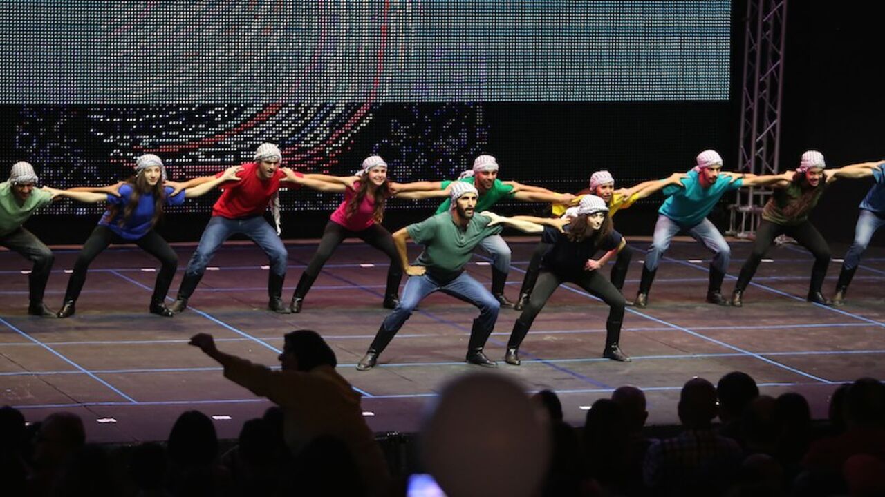 PALESTINIAN-ISRAEL-CULTURE-THEATRE TO GO WITH AFP STORY BY HOSSAM EZZEDINE
Art students perform during the Palesitinian Dance and Song Festival against Discrimination late on August 4, 2015 in the West Bank city of Ramallah. AFP PHOTO / ABBAS MOMANI (Photo credit should read ABBAS MOMANI/AFP/Getty Images)