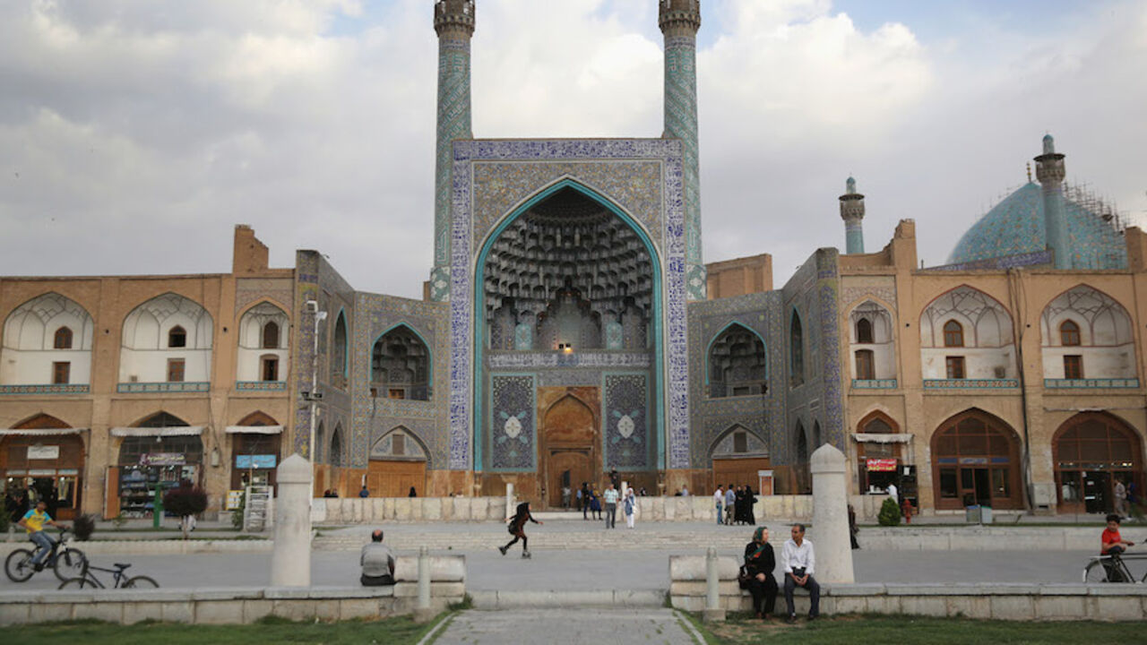 A Trip Through The Heart Of Central Iran 25 Years After Khomeini's Death ISFAHAN, IRAN - JUNE 02: People spend an afternoon at Isfahan's Unesco-listed central square on June 2, 2014 in Isfahan, Iran. Isfahan, with it's immense mosques, picturesque bridges and ancient bazaar, is a virtual living museum of Iranian traditional culture. It's also the Iran's top tourist destination for both Iranian and domestic visitors. On June 4 Iran marks the 25th anniversary of the death of the Ayatollah Khomeini and his legacy of the Islamic Revolution. In the background of the photo is the Ima