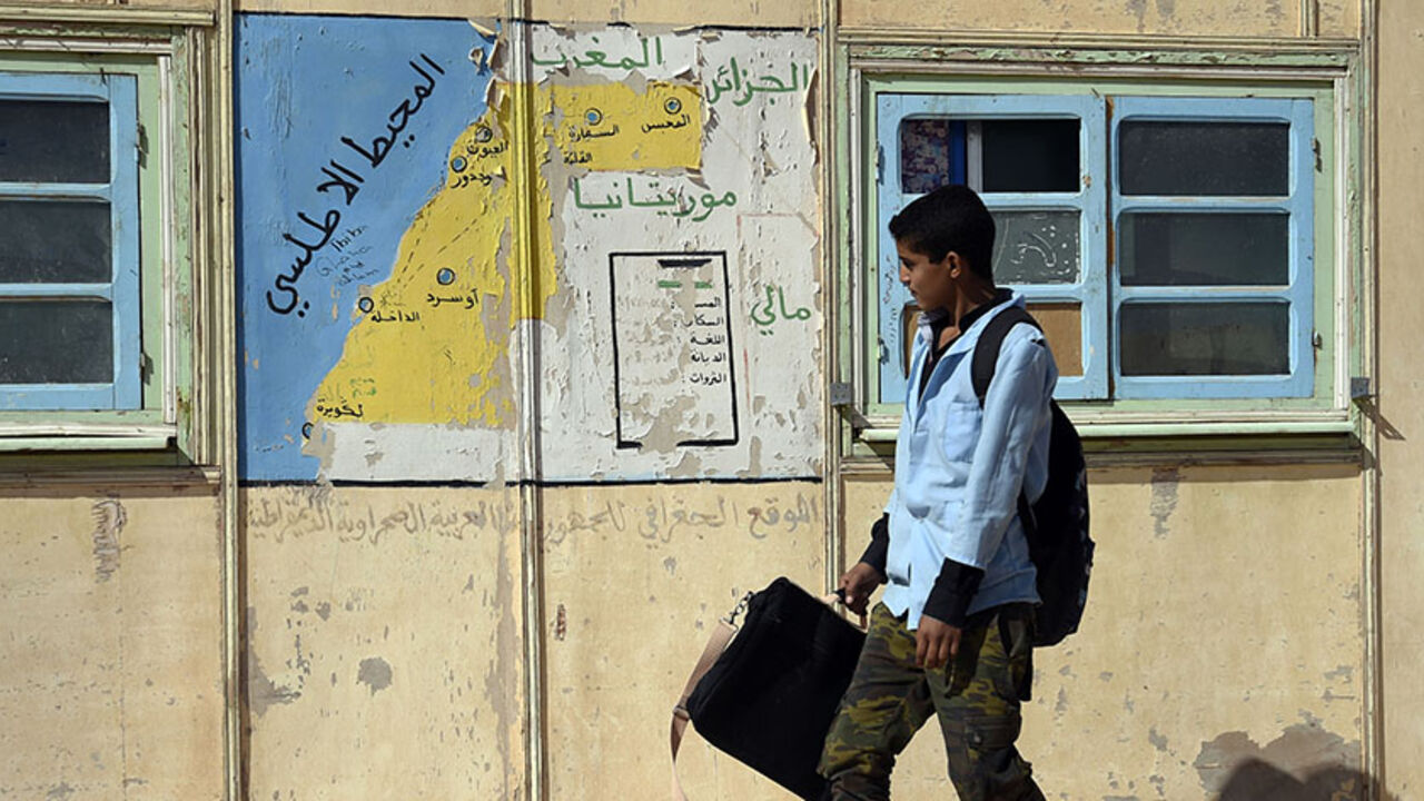 AFP_8864U A student walks past a map at a school in the Smara refugee camp in Algeria's Tindouf province on February 25, 2016.
The Western Sahara is a territory bordered by Morocco and Algeria and disputed by Spain and Morocco who both claiming sovereignty. / AFP / Farouk Batiche (Photo credit should read FAROUK BATICHE/AFP/Getty Images)