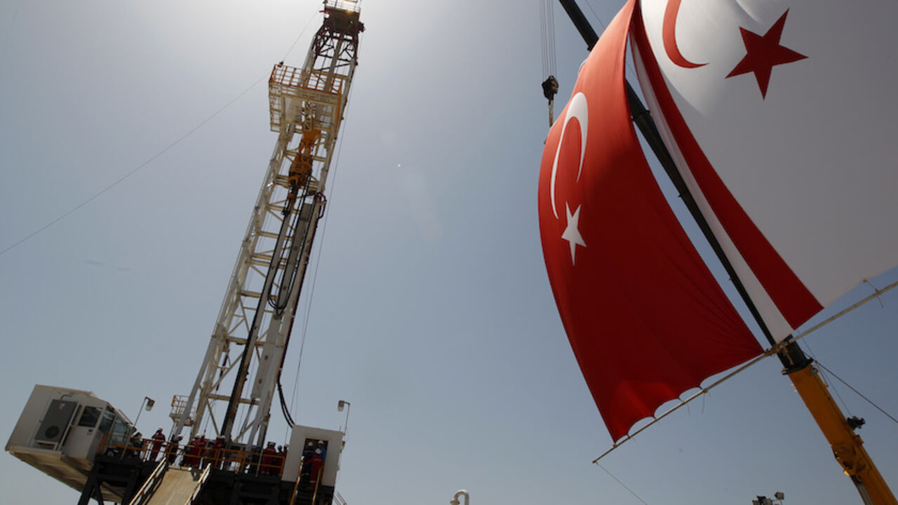 Turkish and Turkish Cypriot flags wave next to a drilling tower 25 km (16 miles) from Famagusta Turkish and Turkish Cypriot flags wave next to a drilling tower 25 km (16 miles) from Famagusta April 26, 2012. Turkish Cypriot Leader Dervis Eroglu and Turkey's Energy Minister Taner Yildiz attended a ceremony marking the start of joint gas and oil exploration works in northern Cyprus between Turkey's state-owned energy company TPAO and the Turkish-Cypriot administration. REUTERS/Umit Bektas (CYPRUS - Tags: POLITICS ENERGY BUSINESS) - RTR318P7