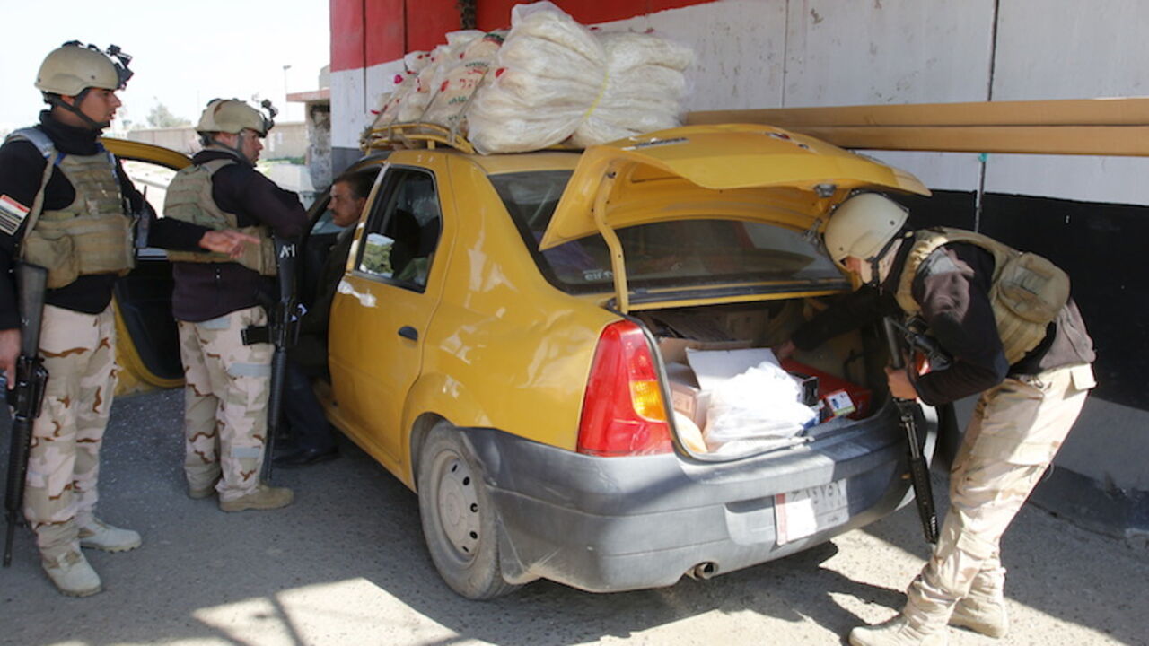 Iraqi security forces check the trunk of a vehicle at a checkpoint, as security measures increase in the west of Baghdad Iraqi security forces check the trunk of a vehicle at a checkpoint, as security measures increase in the west of Baghdad, February 29, 2016. REUTERS/Khalid al Mousily - RTS8KWW