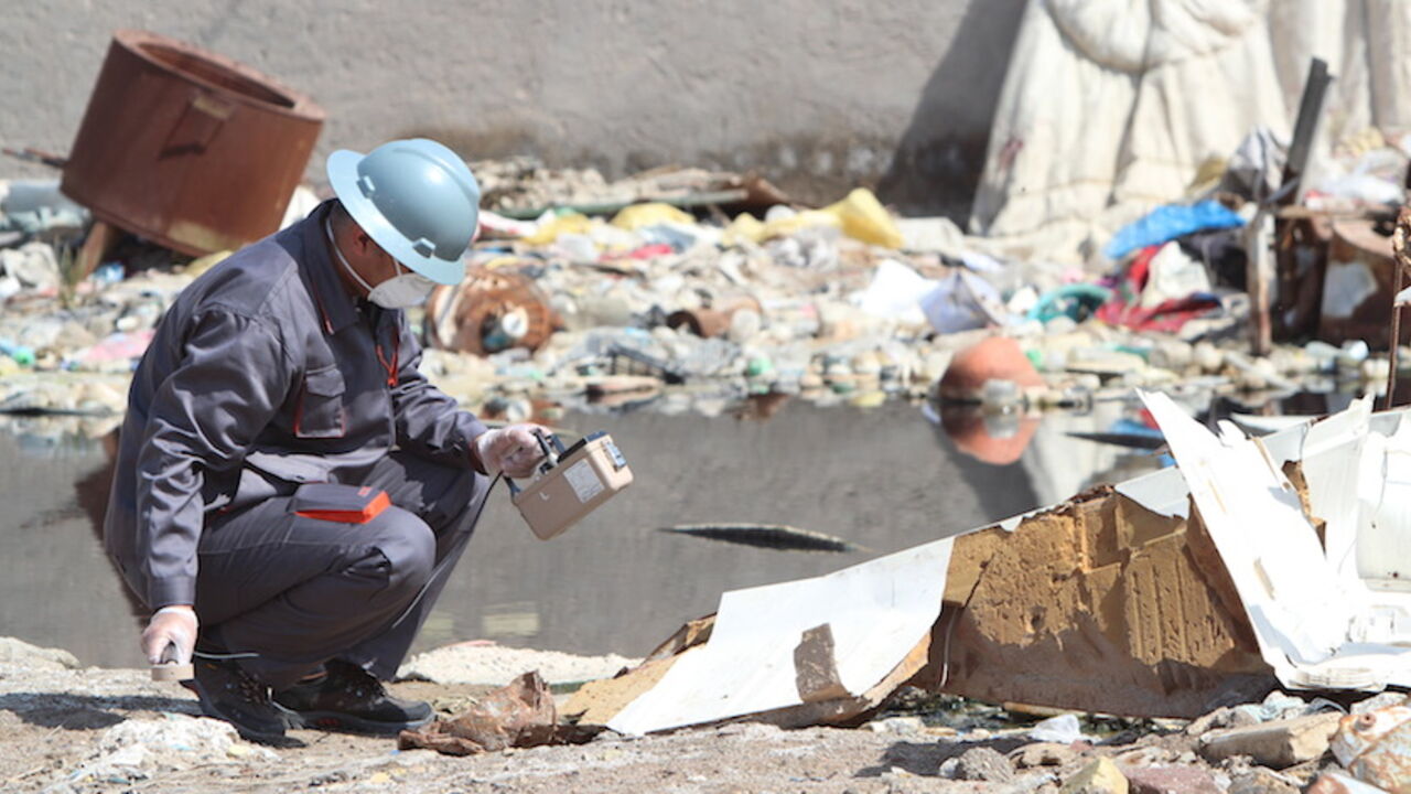 A member of a counter-radiation team uses a Geiger counter to search for missing radioactive material in Basra, Iraq, February 21, 2016. Radioactive material that went missing in Iraq has been found dumped near a petrol station in the southern town of Zubair, officials said on Sunday, ending speculation it could be acquired by Islamic State and used as a weapon. The officials told Reuters the material, stored in a protective case the size of a laptop computer, was undamaged and there were no concerns about 