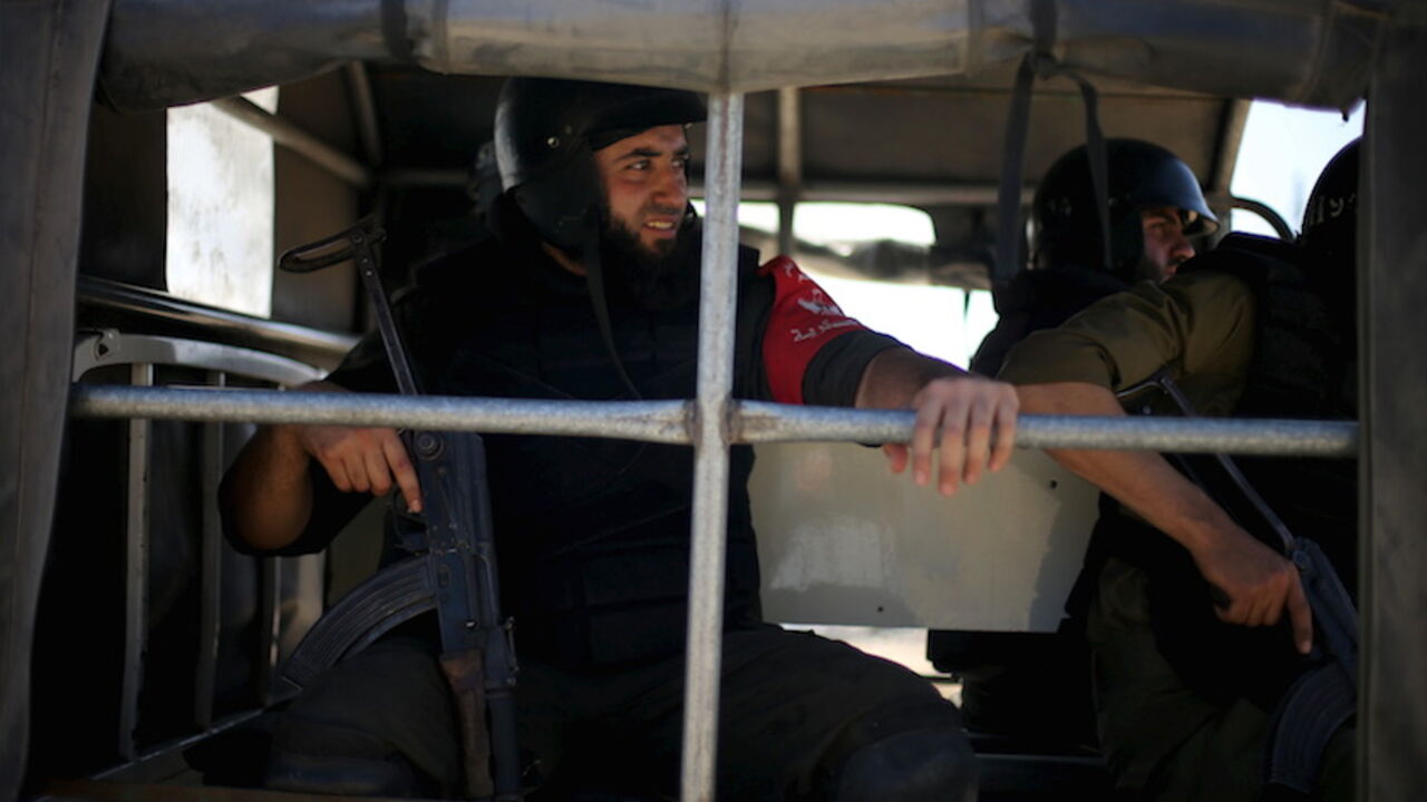 Members of Palestinian security forces loyal to Hamas ride a pickup truck as they are deployed to maintain security on the border of southern Gaza Strip with Egypt Members of Palestinian security forces loyal to Hamas ride a pickup truck as they are deployed to maintain security on the border of southern Gaza Strip with Egypt, April 21, 2016. REUTERS/Ibraheem Abu Mustafa - RTX2AZGA