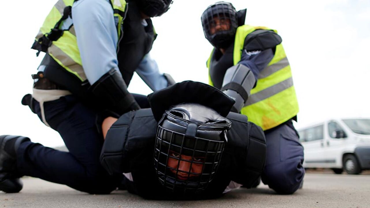 ISRAEL-ARAB/CRIME Arab Israeli police recruits detain their colleague during a simulation as part of a training exercise at Israeli police academy center in Beit Shemesh, Israel August 24, 2016. Picture taken August 24, 2016. REUTERS/Ammar Awad - RTX2N06B
