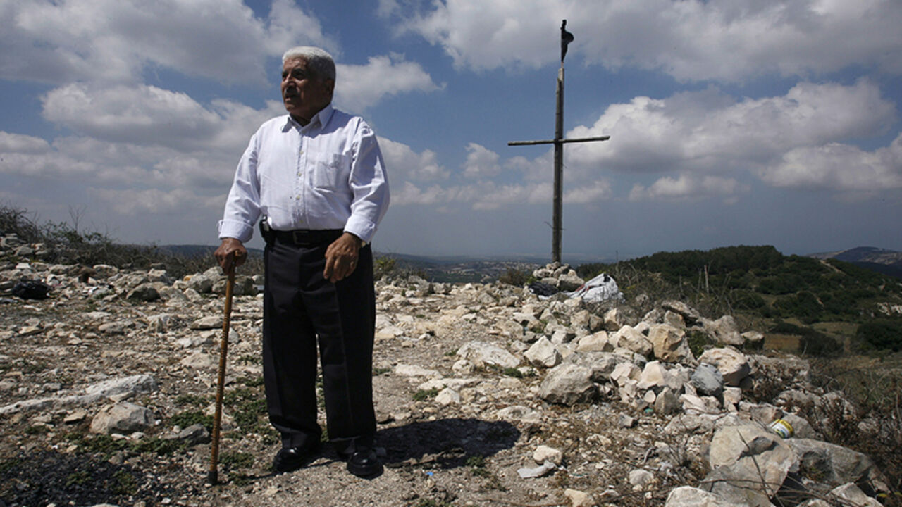 Arabs stand in Iqrit, northern Israel, May 10, 2008, as part of an annual pilgrimage to a village whose residents were ordered out by Jewish fighters during the 1948 Arab-Israeli war. The villagers, Arab citizens of Israel, have long demanded a right to return to the site to live. The visit coincided with Palestinian commemorations of the 1948 ?Nakba? or ?Catastrophe?,  when hundreds of thousands of Palestinians were expelled or fled from their homes in what is now Israel. Picture taken May 10, 2008. REUTER