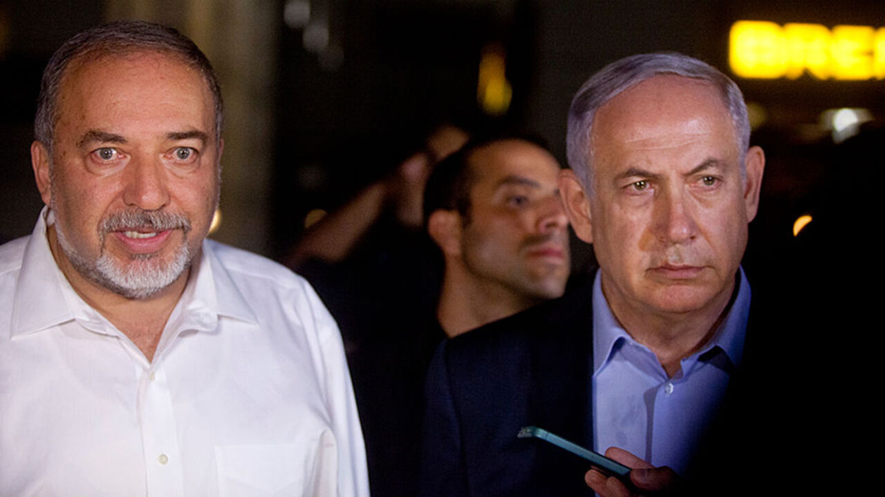 90997433 TEL AVIV, ISRAEL - JUNE 08: Israeli Prime Minister Benjamin Netanyahu (R) and Defence Minister Avigdor Liberman speak to the press at the scene of a shooting outside Max Brenner restaurant in Sarona Market on June 8, 2016 in Tel Aviv, Israel. According to police reports, four Israelis were killed and several others wounded when two Palestinian gunmen open fire at the food and retail complex in central Tel Aviv. (Photo by Lior Mizrahi/Getty Images)