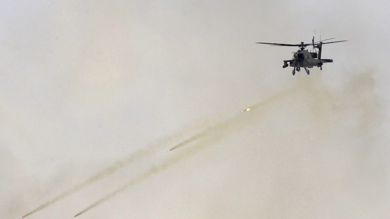 SAUDI-SECURITY/ An aircraft fires missiles during the Northern Thunder exercises, in Hafr Al-Batin, near Saudi Arabia's border with Iraq, March 10, 2016. REUTERS/Abedullah al-Desori EDITORIAL USE ONLY. NO RESALES. NO ARCHIVE - RTSA6JM