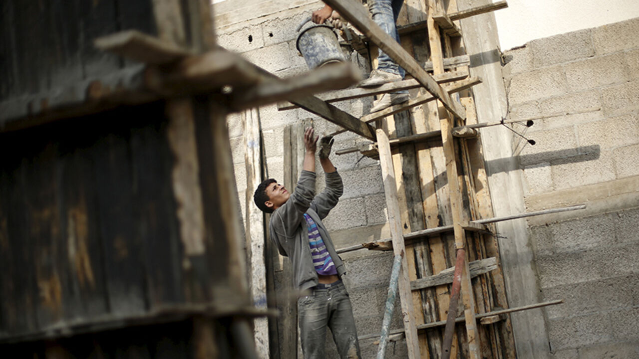 PALESTINIANS-GAZA/CHILD-LABOUR Palestinian boy Abed al-Kareem Yassin, 16, works at a construction site of a house in Gaza City March 21, 2016. Yassin, whose father is unemployed, earns 40 Shekels ($10.3) per working day, and he and his two brothers are the main breadwinners of his family. The boy, who quit school, hopes to be a mechanic. REUTERS/Mohammed Salem SEARCH "SALEM LABOUR" FOR THIS STORY. SEARCH "THE WIDER IMAGE" FOR ALL STORIES - RTSCT7H