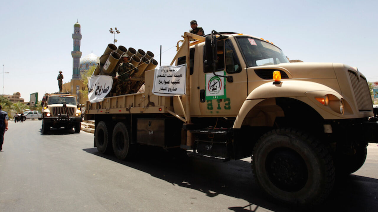 MIDEAST-CRISIS/IRAQ Vehicles of the Hashid Shaabi (Popular Mobilization) take part in a military parade in the streets of Baghdad, Iraq July 12, 2016. REUTERS/Khalid al Mousily - RTSHJ8D