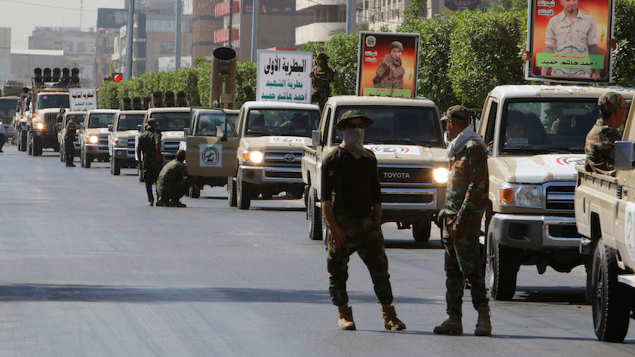 MIDEAST-CRISIS/IRAQ Vehicles of the Hashid Shaabi (Popular Mobilization) take part in a military parade in the streets of Baghdad, Iraq July 12, 2016. REUTERS/Khalid al Mousily - RTSHJ8G