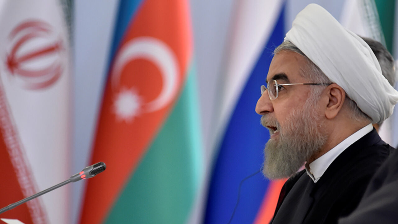 AZERBAIJAN-SUMMIT/ Iranian President Hassan Rouhani makes a speech during a signing ceremony after a meeting with Russian President Vladimir Putin and Azeri President Ilham Aliyev (not seen) in Baku, Azerbaijan, August 8, 2016. REUTERS/Alexander Nemenov/Pool - RTSLVFF