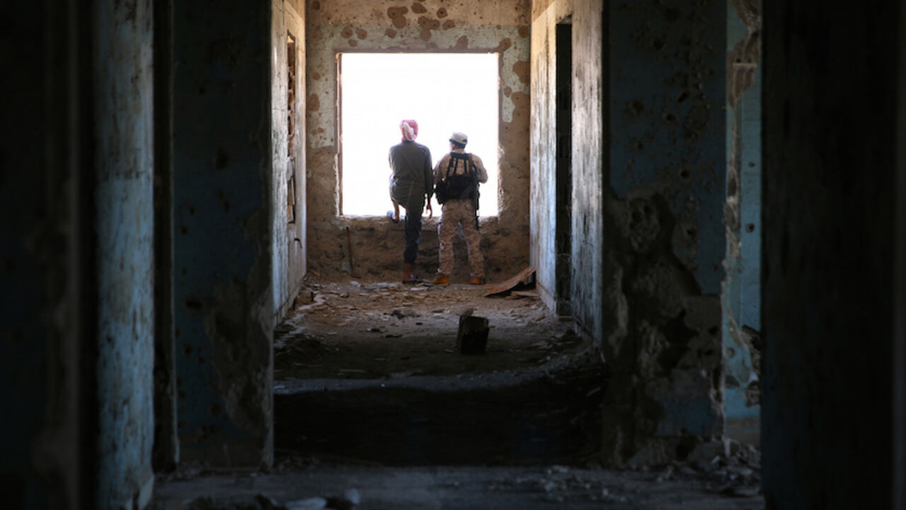 MIDEAST-CRISIS/SYRIA Rebel fighters stand in a damaged building in Quneitra countryside, Syria September 10, 2016. REUTERS/Alaa Al-Faqir TPX IMAGES OF THE DAY - RTSN5B5