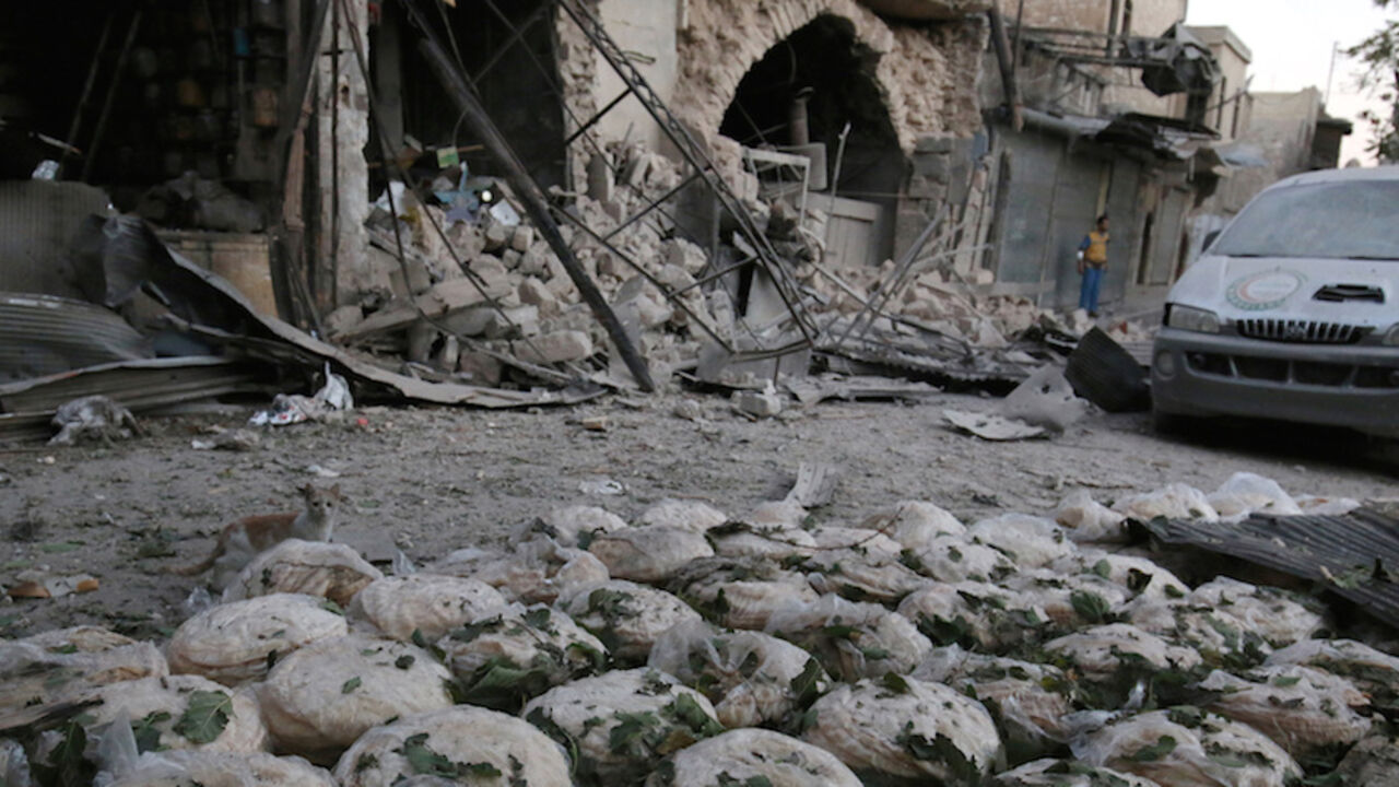 MIDEAST-CRISIS/SYRIA-ATTACK Stacks of bread are seen at a damaged site after an airstrike in the rebel-held Bab al-Maqam neighbourhood of Aleppo, Syria, September 28, 2016. REUTERS/Abdalrhman Ismail TPX IMAGES OF THE DAY - RTSPSQQ