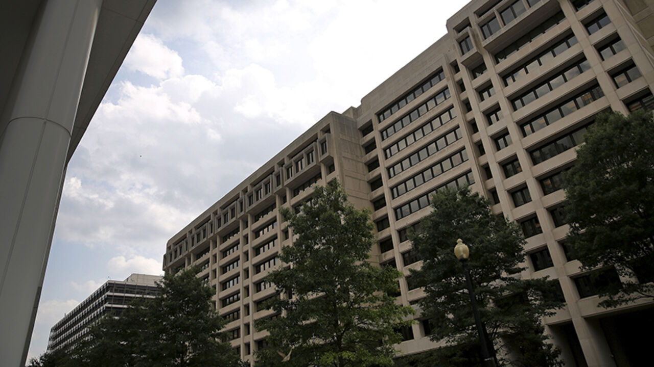 IMF-LAGARDE/ An exterior view of the International Monetary Fund (IMF) headquarters is seen in Washington July 1, 2015. Greece's last-minute overtures to international creditors for financial aid on Tuesday were not enough to save the country from becoming the first developed economy to default on a loan with the International Monetary Fund. REUTERS/Jonathan Ernst - RTX1IO51