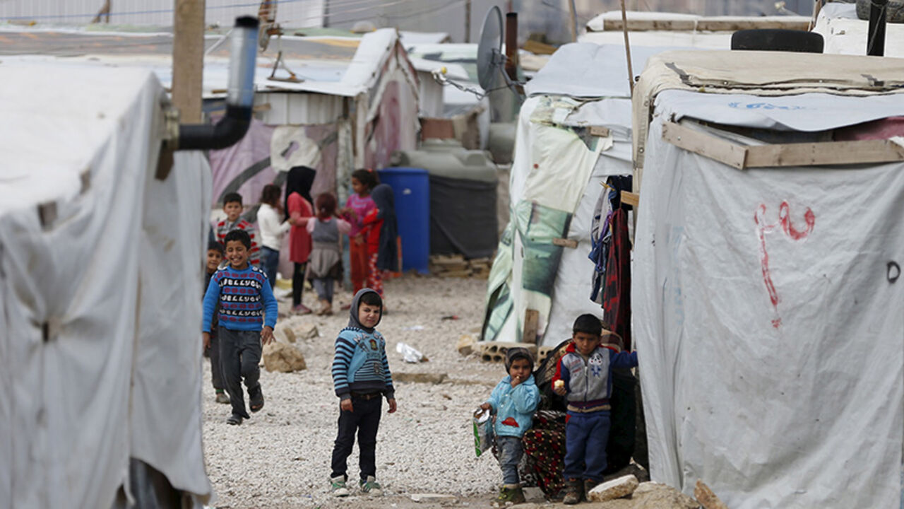 MIDEAST-CRISIS/LEBANON-REFUGEES Syrian children are seen inside an informal settlement for Syrian refugees in Bar Elias, Bekaa valley, Lebanon, January 6, 2016. More than 1 million Syrians are enduring another winter as refugees in Lebanon. For some, it is their fifth in a row, displaced by a war that has driven 4.4 million Syrians into neighbouring states from where many are trying to reach Europe. REUTERS/ Jamal Saidi - RTX21K68