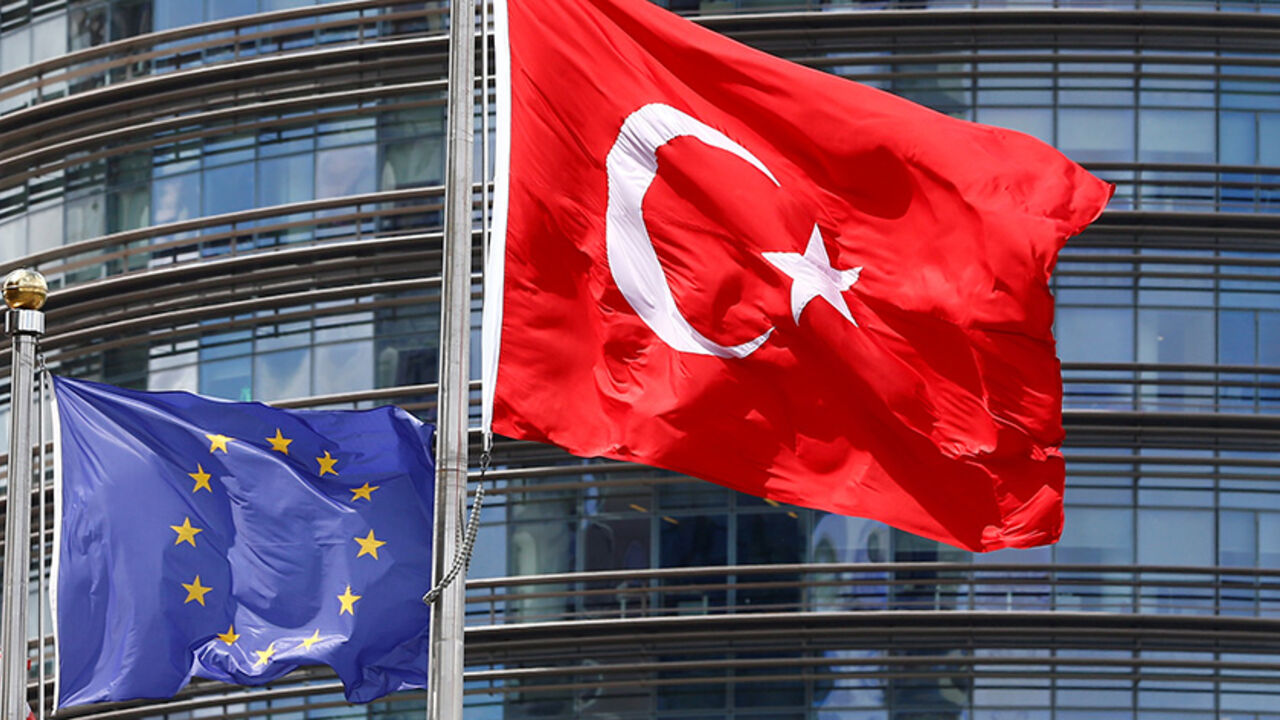 EUROPE-MIGRANTS/EU-TURKEY European Union (L) and Turkish flags fly outside a hotel in Istanbul, Turkey May 4, 2016. REUTERS/Murad Sezer/File Photo - RTX2EIB4