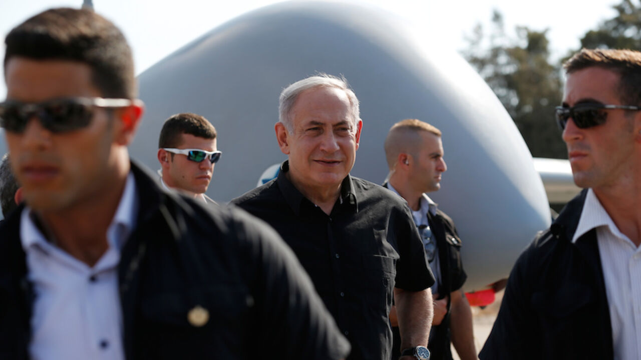 Israeli Prime Minister Netanyahu is surrounded by bodyguards during his visit to the Tel Nof airforce base in southern Israel Israeli Prime Minister Benjamin Netanyahu (C) is surrounded by bodyguards during his visit to the Tel Nof airforce base in southern Israel August 17, 2016. REUTERS/Amir Cohen - RTX2LITQ