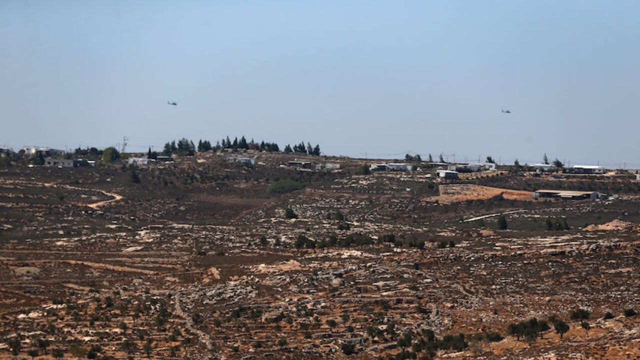 AFP_G89B1 A picture taken from the West Bank Christian village of Taybeh on September 11, 2016, shows the wildcat Jewish settlement of Amona.
An Israeli court has ruled that the wildcat Jewish settlement of Amona, where live around 40 families in mainly caravan homes, is on Palestinian property and must be evacuated by December 25. Settlements such as Amona are called outposts -- those that Israel has not approved. Outpost residents hope such authorisation will one day be provided, as has occurred in other cases. Amo